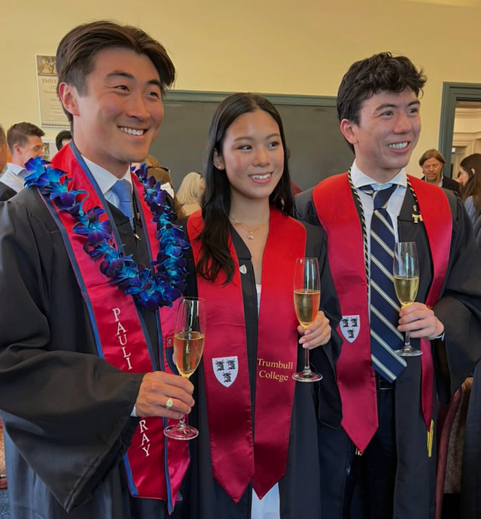 Three graduating Classics undergraduates during yearly commencement reception